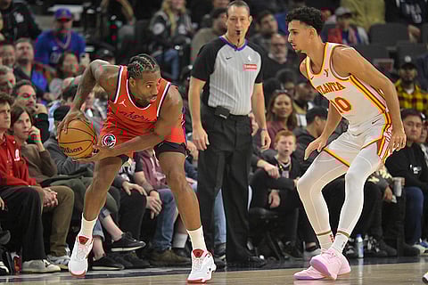 NBA 2024-25: Clippers forward Kawhi Leonard, left, is defended by Atlanta Hawks forward