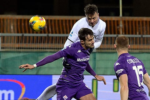 Serie A 2024-25: Napoli's Amir Rrahmani, top, heads the ball over Fiorentina's Luca Ranieri