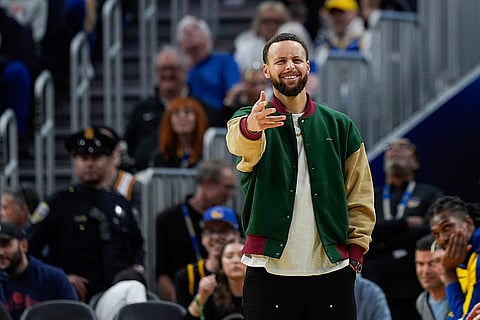 NBA 2024-25: Warriors guard Stephen Curry reacts from the bench