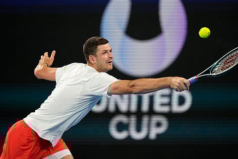 United Cup Tennis: Poland's Hubert Hurkacz hits a backhand to Taylor Fritz