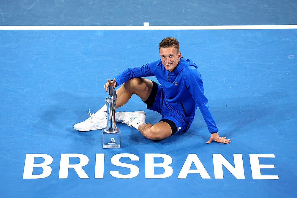 | Photo: AP/Pat Hoelscher : Brisbane International Tennis: Czech Republic's Jiri Lehecka poses with his trophy