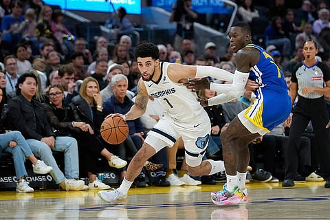 NBA 2024-25: Grizzlies guard Scotty Pippen Jr., front left, moves the ball while defended by Warriors guard