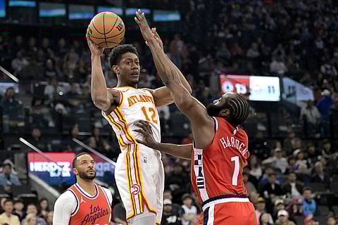 NBA 2024-25: Hawks forward De'Andre Hunter is defended by Clippers guard James Harden