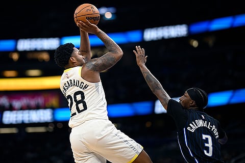 NBA 2024-25: Jazz forward Brice Sensabaugh (28) shoots in front of  Magic guard