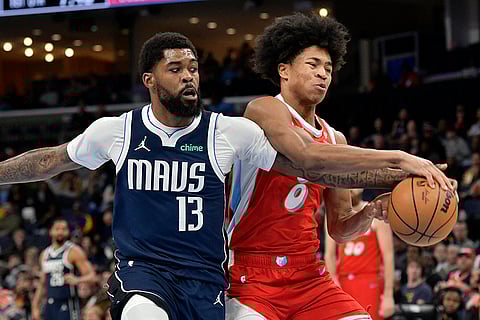 NBA 2024-25: Mavericks forward Naji Marshall (13) and Grizzlies forward Jaylen Wells (0) struggle for control of the ball