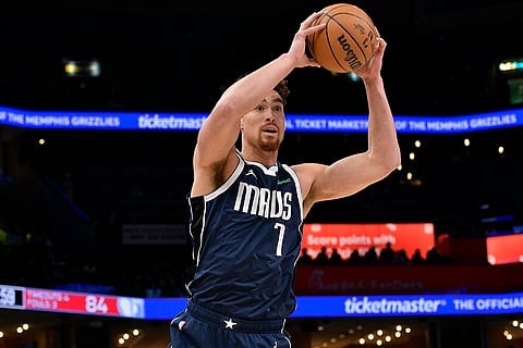 NBA 2024-25: Dallas Mavericks center Dwight Powell handles the ball