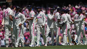 AP : Australian and Indian players shake hands after the fifth Test at the Sydney Cricket Ground.