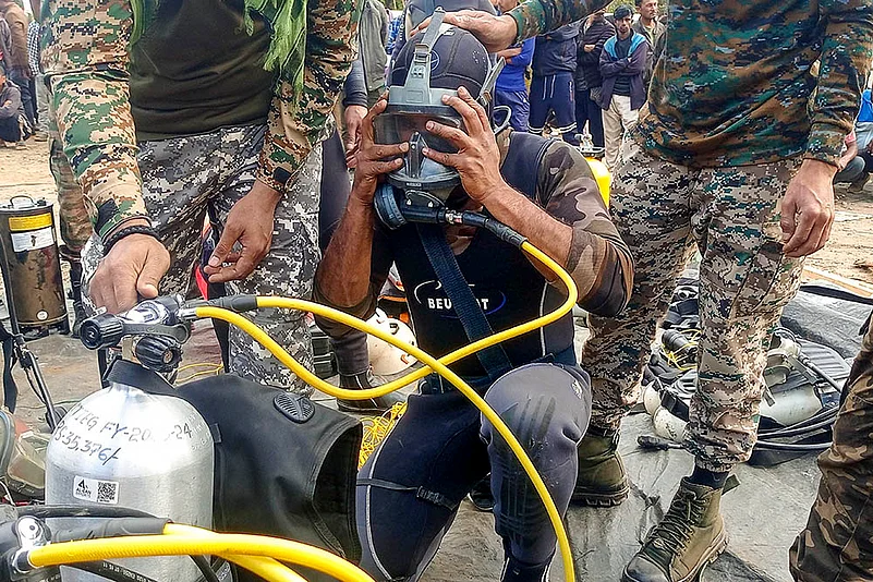 Rescue operation underway Labourers trapped inside a coal mine in Assam photo: 7