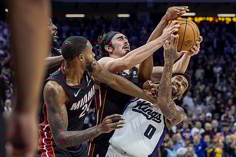 NBA 2024-25: Kings guard Malik Monk (0) fights for a rebound with Heat guard Jaime Jaquez Jr.
