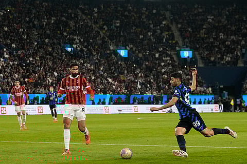 Italian Super Cup Final: AC Milan's Ruben Loftus-Cheek, left, watches as Inter Milan's Mehdi Taremi passes the ball