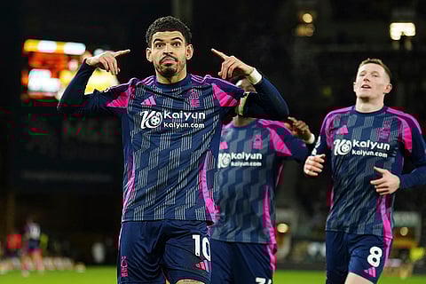 EPL 2024-25: Nottingham Forest's Morgan Gibbs-White, left, celebrates scoring their side's first goal