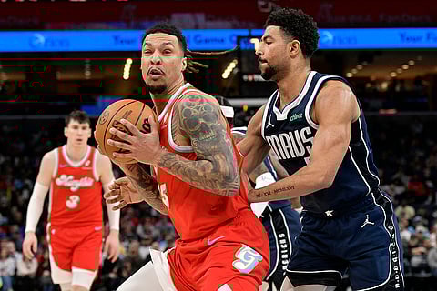 NBA 2024-25: Grizzlies forward Brandon Clarke, front left, handles the ball against Mavericks