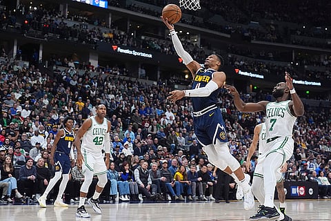 NBA 2024-25: Nuggets guard Russell Westbrook, center, drives to the basket