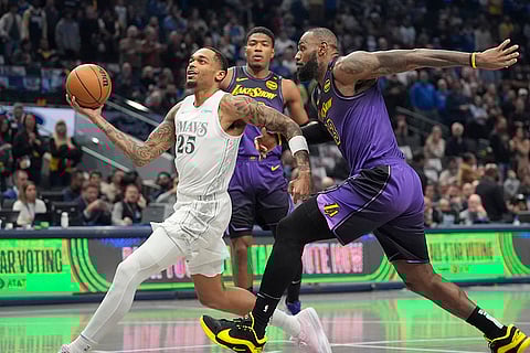 NBA 2024-25: Mavericks forward P.J. Washington (25) drives past Lakers forward LeBron James