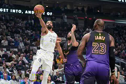 NBA 2024-25: Mavericks forward P.J. Washington (25) drives against Lakers forwards Anthony Davis