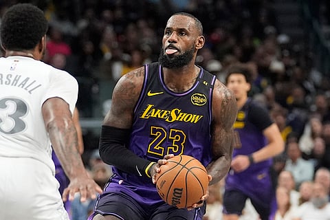NBA 2024-25: Lakers forward LeBron James (23) moves the ball against Mavericks forward Naji Marshall