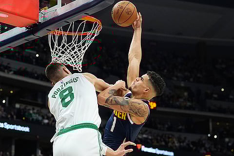 NBA 2024-25: Nuggets forward Michael Porter Jr., right, dunks the ball