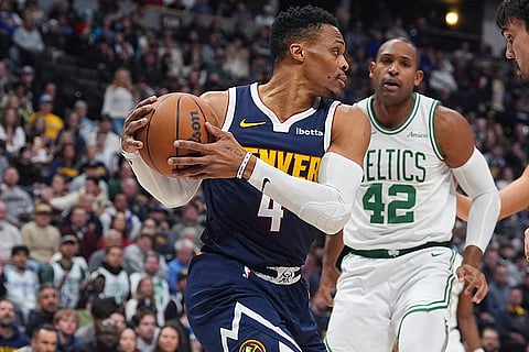 NBA 2024-25: Nuggets guard Russell Westbrook, front, collects a rebound