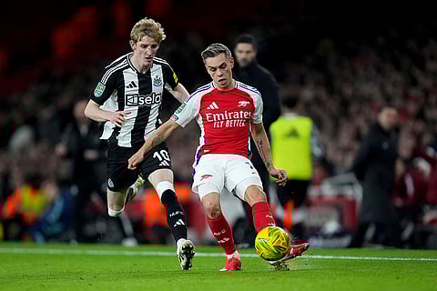 EFL Cup 2024-25: Arsenal's Leandro Trossard, right, fights for the ball with Newcastle's Anthony Gordon