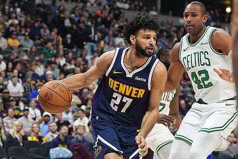 NBA 2024-25: Nuggets guard Jamal Murray, left, drives past Celtics center Al Horford