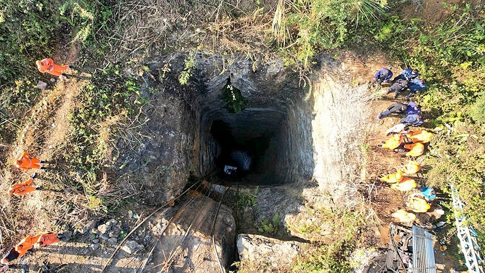 | Photo: PTI : Labourers trapped inside a coal mine in Assam
