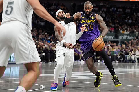 NBA 2024-25: Lakers forward LeBron James (23) tries to get past Mavericks guard Jaden Hardy
