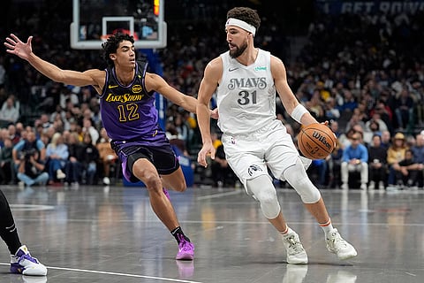 NBA 2024-25: Mavericks guard Klay Thompson (31) drives against Los Angeles Lakers guard
