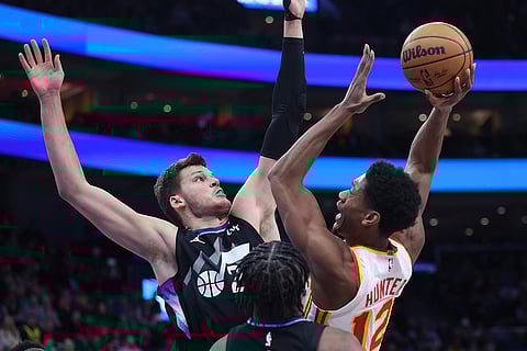 NBA 2024-25: Hawks forward De'Andre Hunter (12) goes to the basket