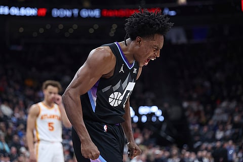 NBA 2024-25: Jazz guard Collin Sexton reacts to a play against the Hawks