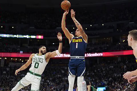 NBA 2024-25: Nuggets forward Michael Porter Jr., right, shoots for a basket