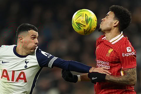 EFL Cup Semi-Final: Tottenham's Pedro Porro duels for the ball with Liverpool's Luis Diaz
