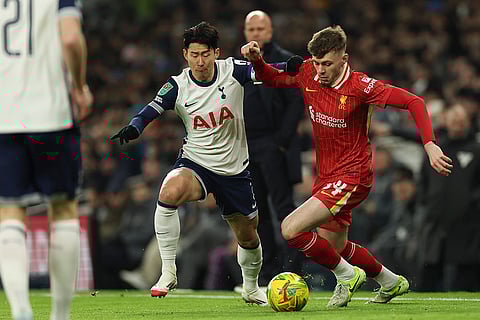 EFL Cup Semi-Final: Tottenham's Son Heung-min duels for the ball with Liverpool's Conor Bradley