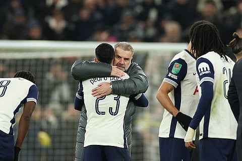 EFL Cup Semi-Final: Tottenham's head coach Ange Postecoglou celebrates with players