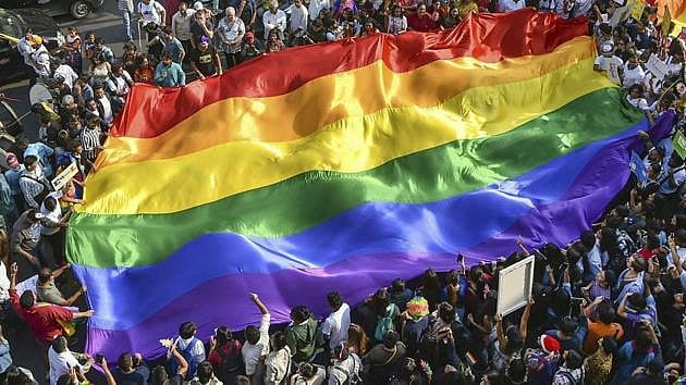 PTI : LGBTQ community people waving rainbow flag
