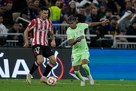 Spanish Super Semi-Final: Athletic Bilbao's Yuri Berchiche and Barcelona's Lamine Yamal fight for the ball
