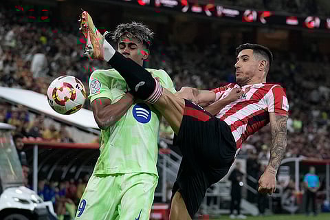 Spanish Super Semi-Final: Barcelona's Lamine Yamal, left, and Athletic Bilbao's Yuri Berchiche fight for the ball