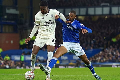 FA Cup 2024-25: Peterborough United's Emmanuel Fernandez, left, and Everton's Beto battle for the ball