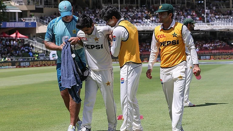 SA vs PAK 2nd test Day 1: Pakistan's Saim Ayub is helped from the field after injuring his ankle - | Photo: AP/Halden Krog