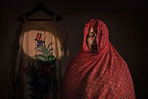 | Photo: Fatma Fahmy : Dreaming of Home: Khwater, 35, from the northern part of Sudan, sought refuge in Egypt with her sister. After her sister passed away from cancer, “the world stopped” for her