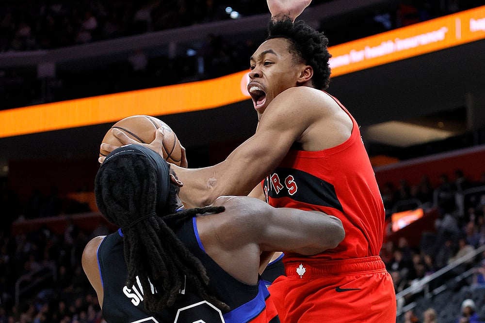 | Photo: AP/Duane Burleson : NBA 2024-25: Raptors forward Scottie Barnes, right, looks to pass the ball against Pistons