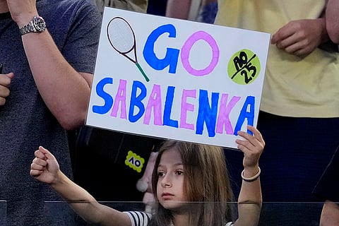 Australian Open 2025: A young fan holds a poster for Aryna Sabalenka