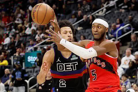 NBA 2024-25: Raptors guard Immanuel Quickley (5) passes the ball