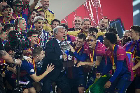 Spanish Super Cup 2025 Final: President of Barcelona Joan Laporta, centre, and his players celebrate with the trophy