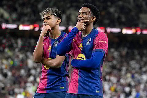 Spanish Super Cup 2025 Final: Barcelona's Alejandro Balde, right, and Barcelona's Lamine Yamal react