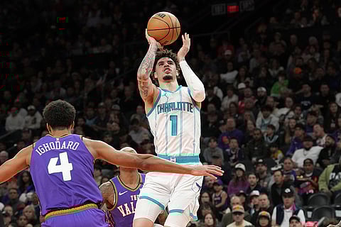 NBA 2024-25: Hornets guard LaMelo Ball (1) drives past Suns center Oso Ighodaro