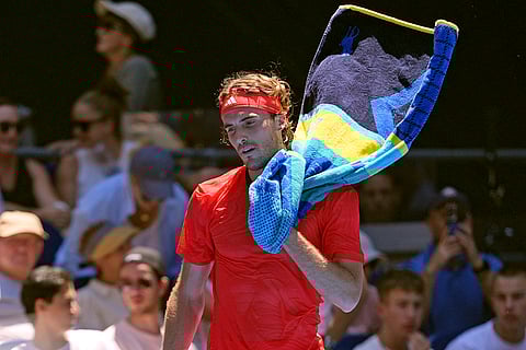 Australian Open 2025: Stefanos Tsitsipas walks to receive serve from Alex Michelsen