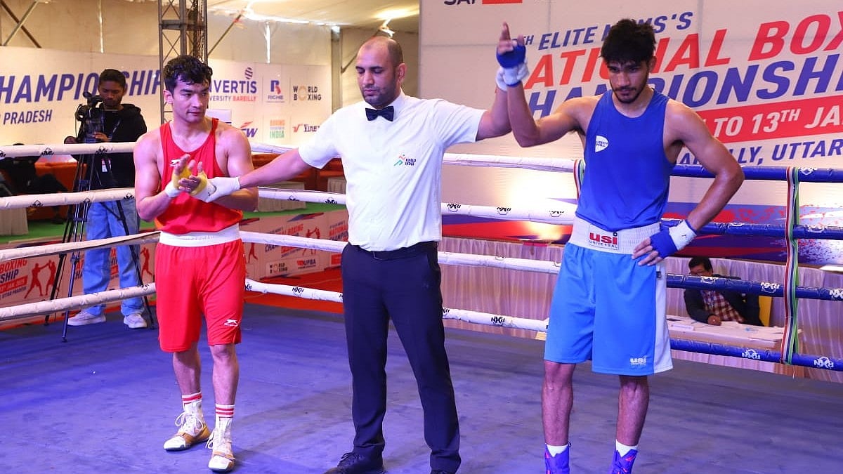Special Arrangement : Abhinash Jamwal being declared winner of his semi-final bout versus Shiva Thapa.