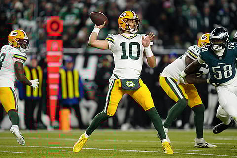 NFL Football Play-off - Packers vs Eagles: Packers quarterback Jordan Love (10) looks to pass