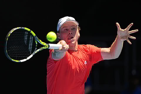 Australian Open 2025: Alex Michelsen plays a forehand return to Stefanos Tsitsipas
