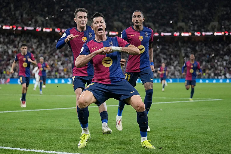 Barcelona's Robert Lewandowski celebrates after scoring his side's second goal - | Photo: AP/Altaf Qadri